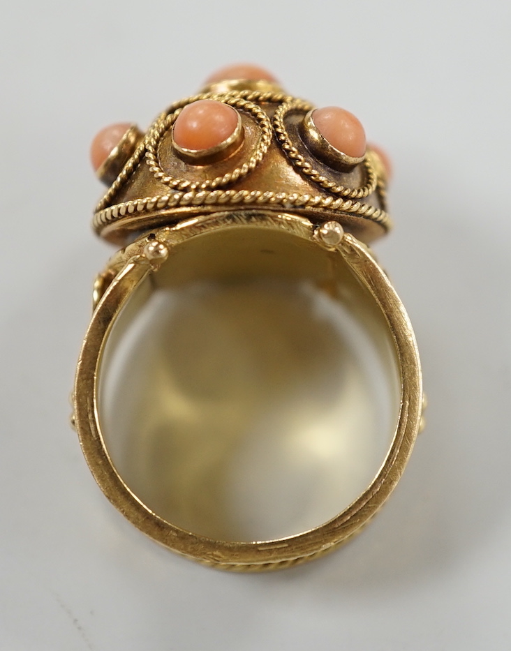 A 20th century yellow metal, coral bead and cannetile work set dress ring, size N/O